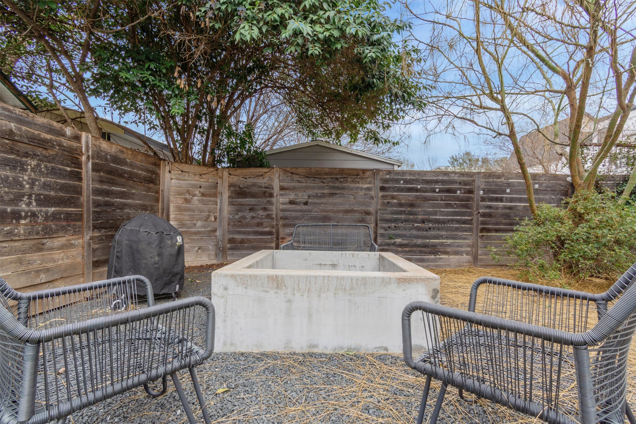 2706 Zaragosa Street, Unit 2 Austin, TX 78702 - Photo 18 of 25 A fully fenced outdoor retreat with a built-in fire pit — your own private Texas escape.