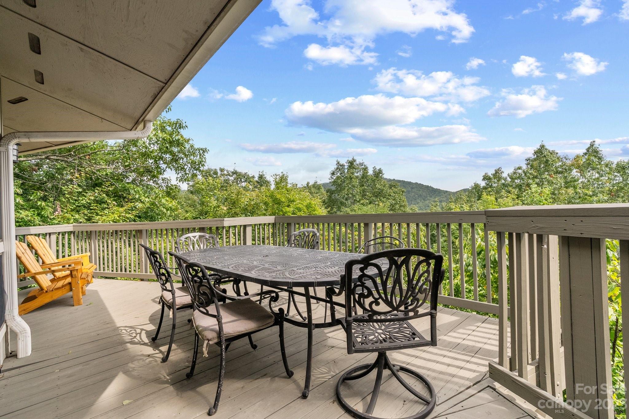 98 Westminster Road Montreat, NC 28711 - Photo 11 of 37 a view of a chairs and table in patio with wooden floor