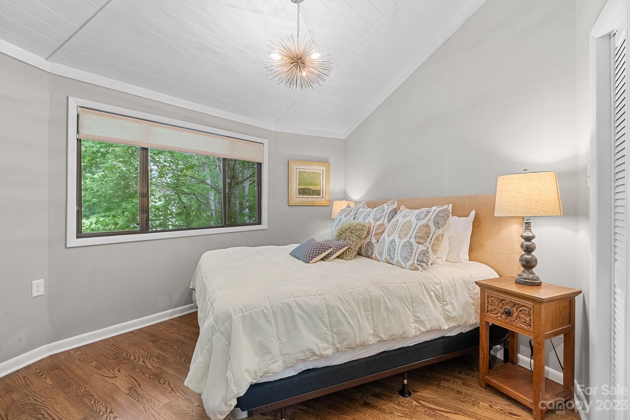 98 Westminster Road Montreat, NC 28711 - Photo 13 of 37 a bedroom with a bed and a night stand