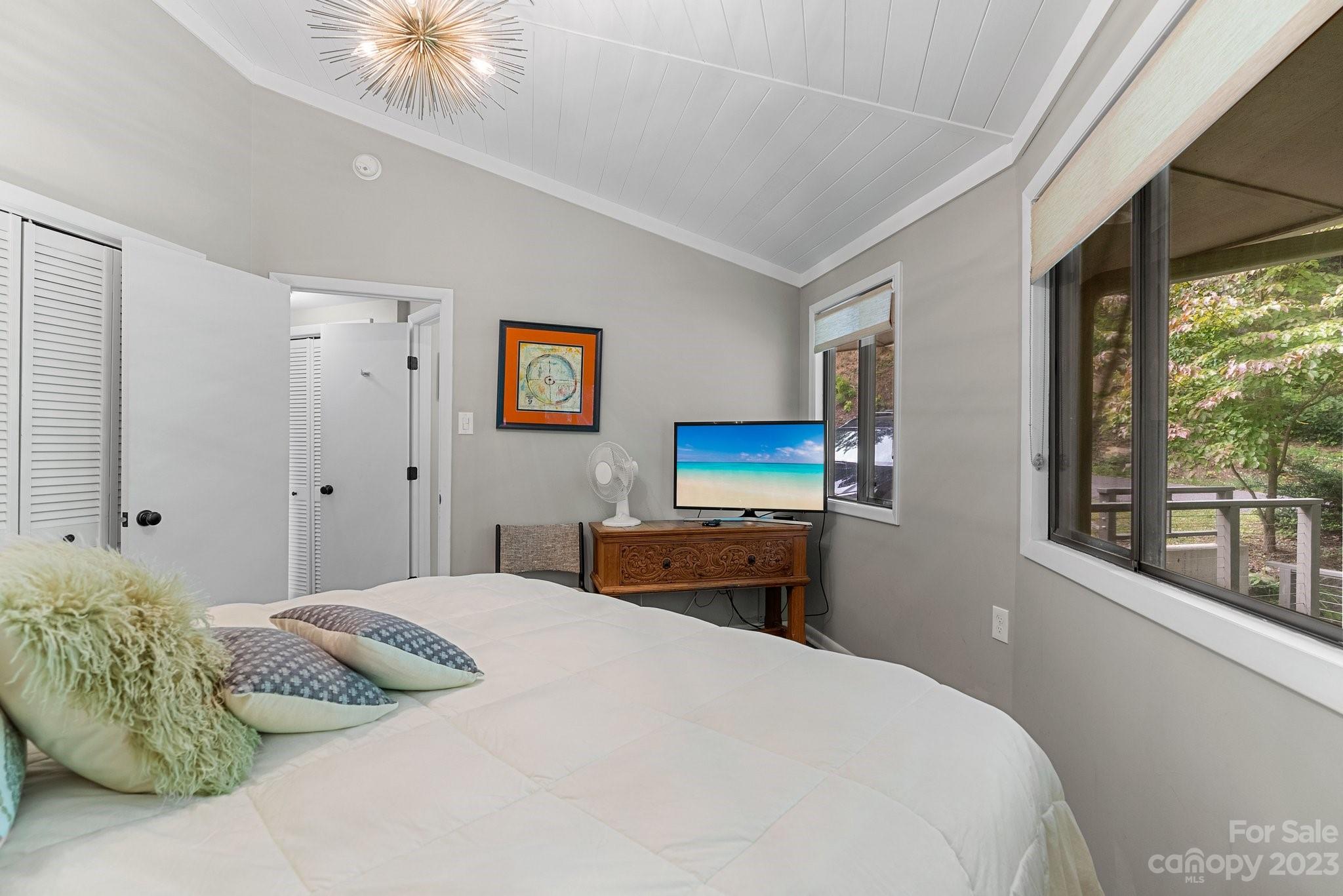 98 Westminster Road Montreat, NC 28711 - Photo 14 of 37 a bedroom with a bed and a tv