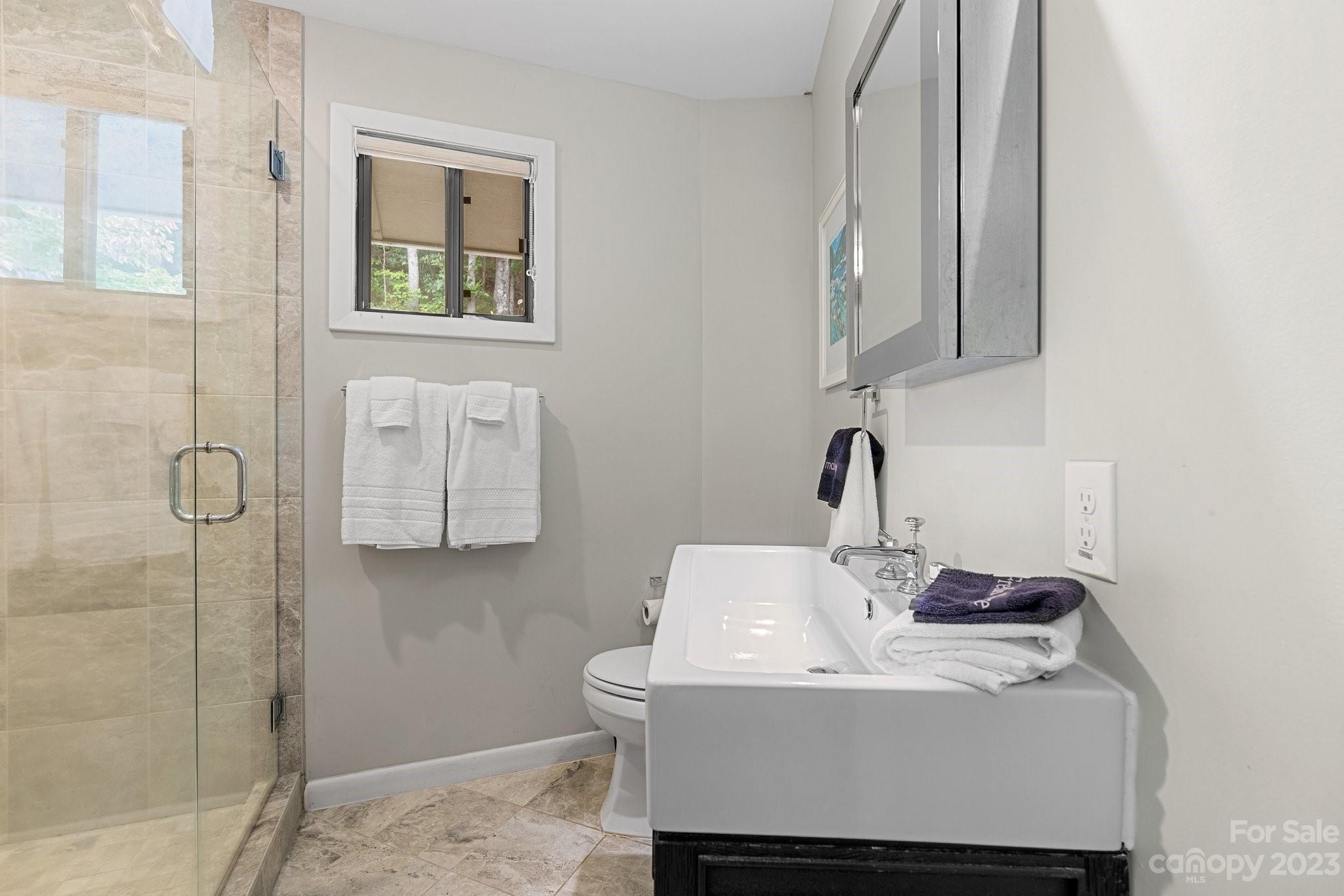 98 Westminster Road Montreat, NC 28711 - Photo 16 of 37 a bathroom with a sink and a mirror
