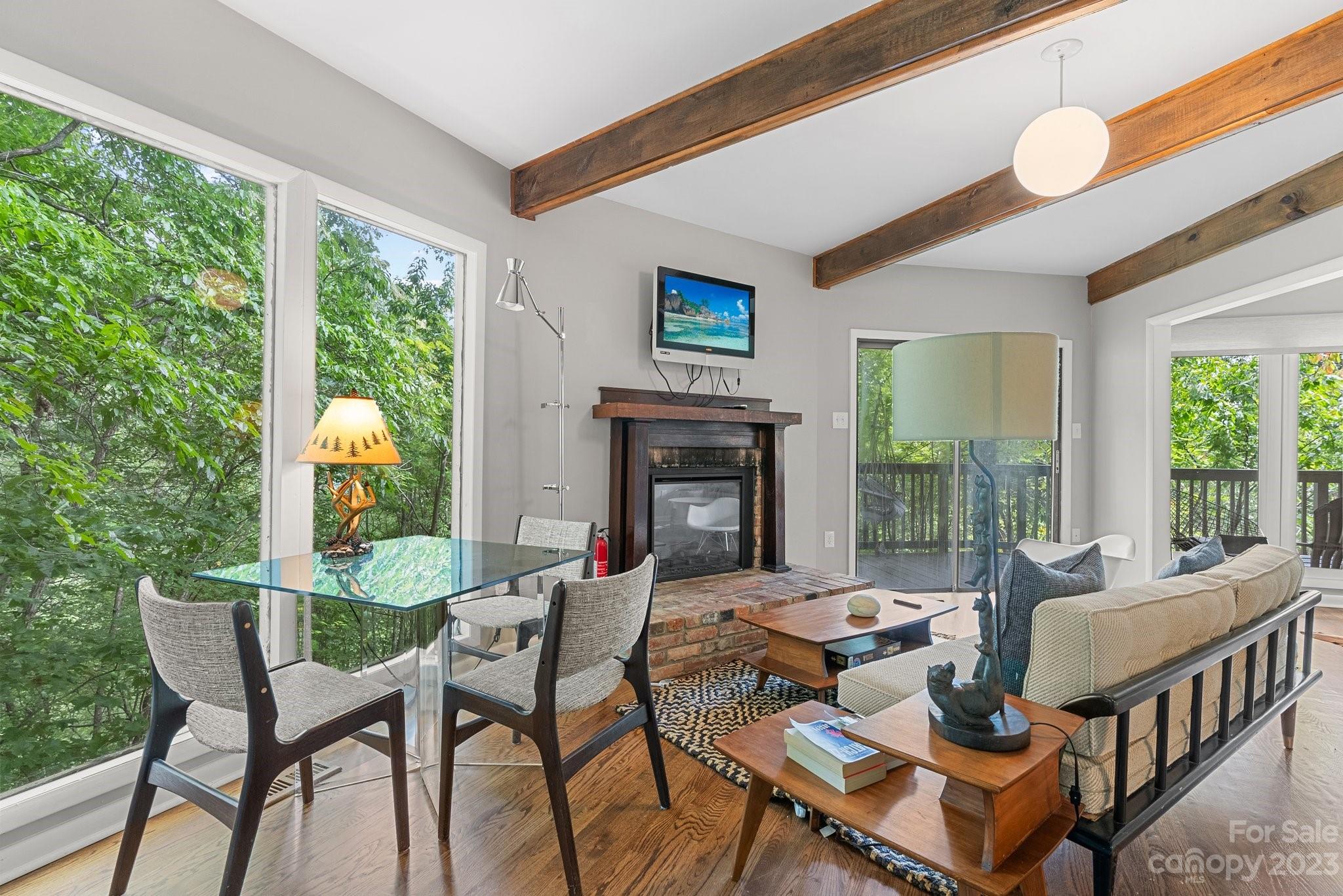 98 Westminster Road Montreat, NC 28711 - Photo 19 of 37 a living room with fireplace furniture and a large window