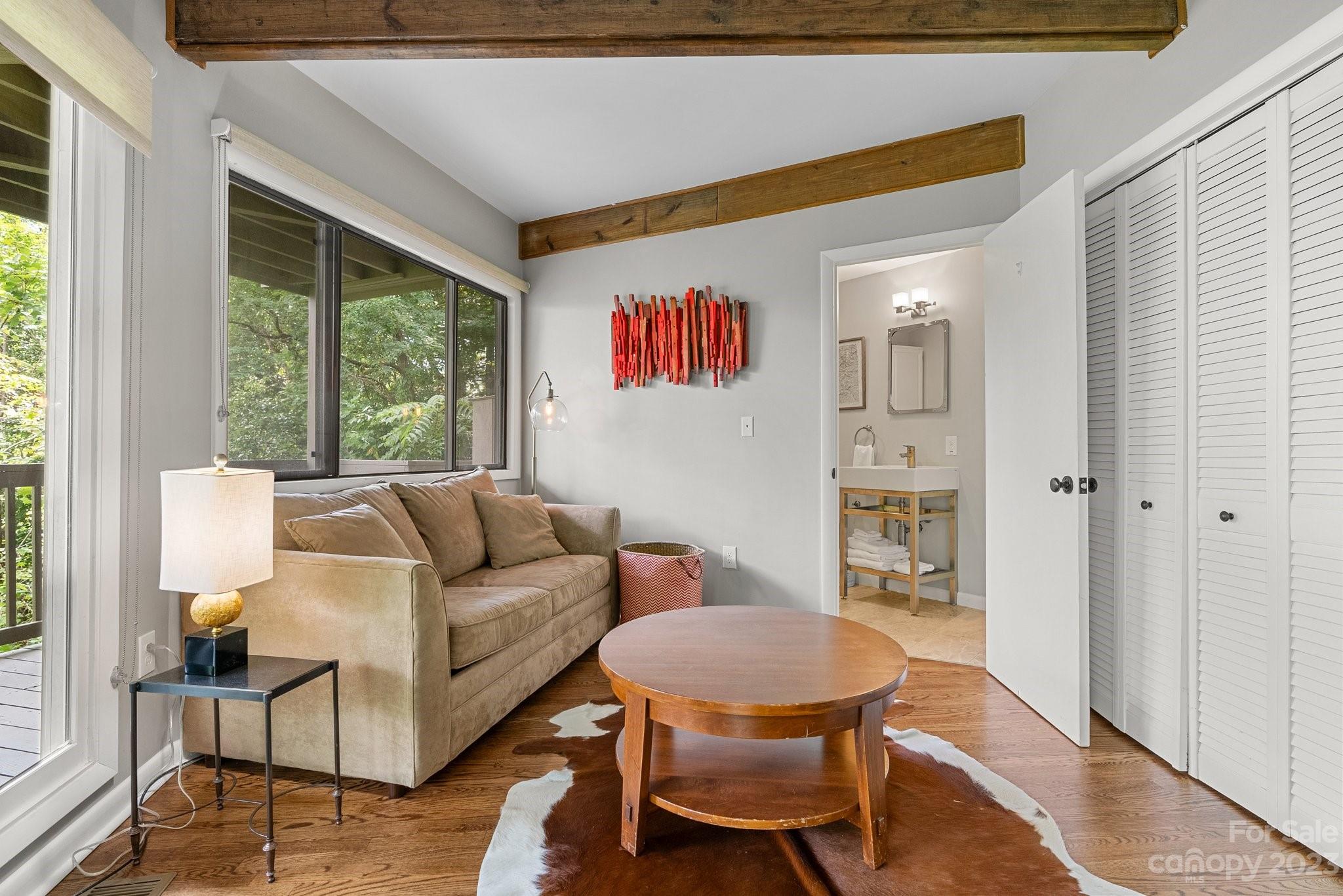 98 Westminster Road Montreat, NC 28711 - Photo 21 of 37 a living room with furniture and a large window