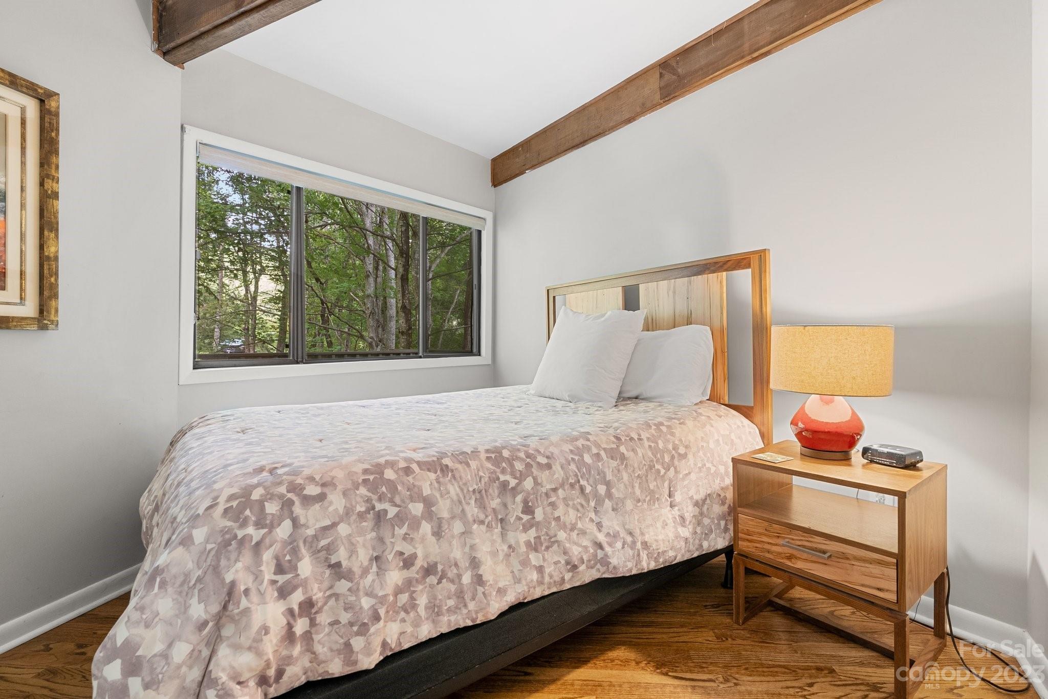 98 Westminster Road Montreat, NC 28711 - Photo 22 of 37 a bedroom with a bed and a window