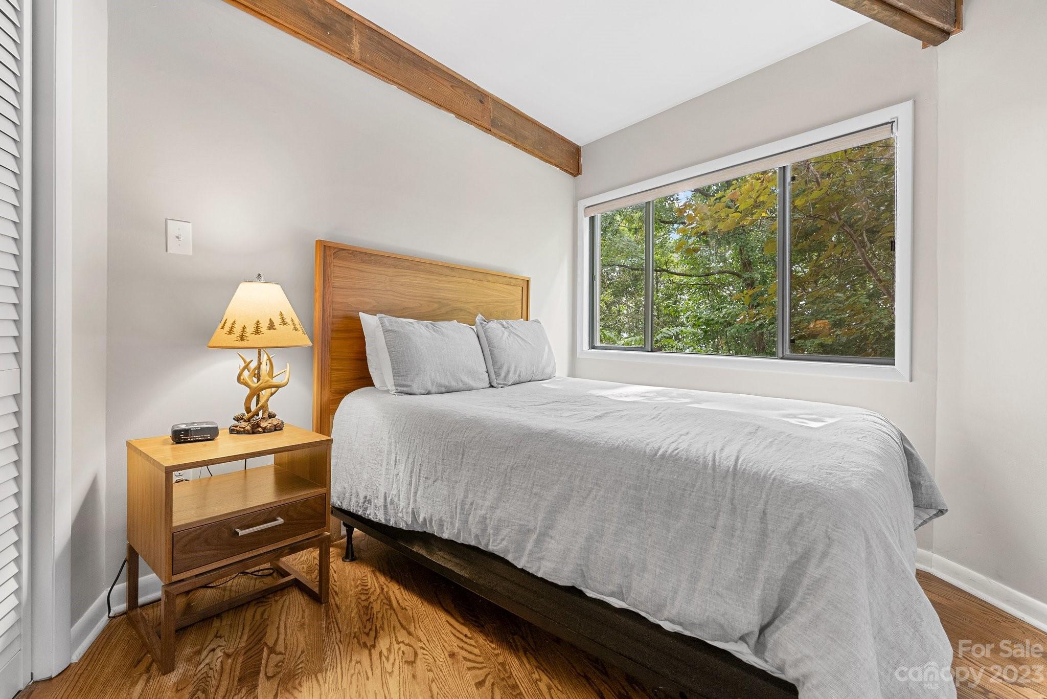 98 Westminster Road Montreat, NC 28711 - Photo 23 of 37 a bedroom with a bed and window