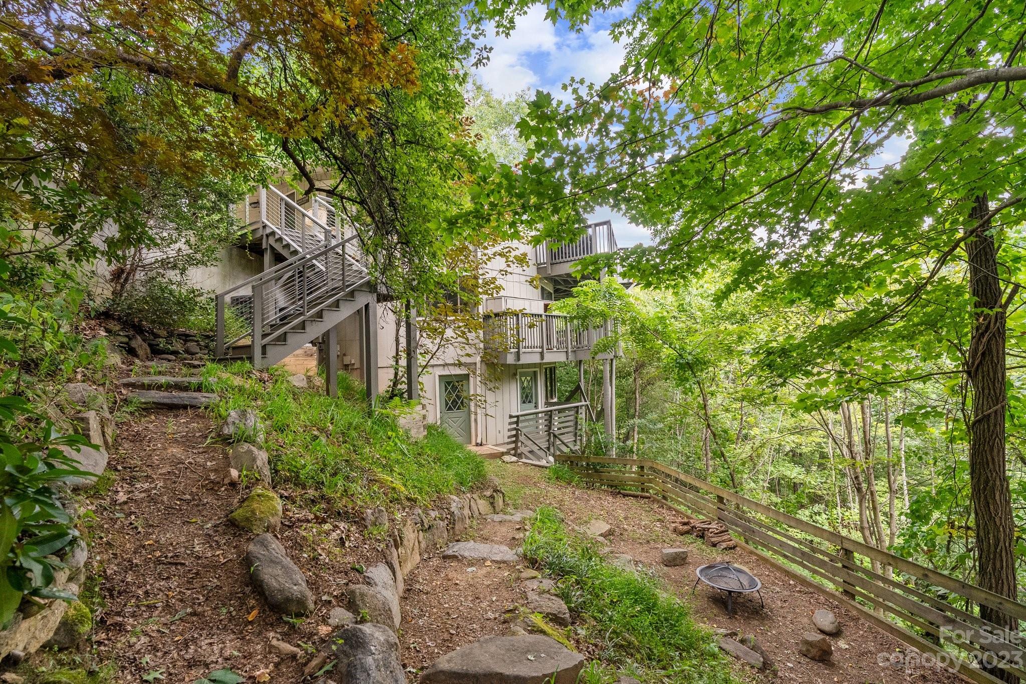 98 Westminster Road Montreat, NC 28711 - Photo 32 of 37 a view of a big yard with plants and large trees