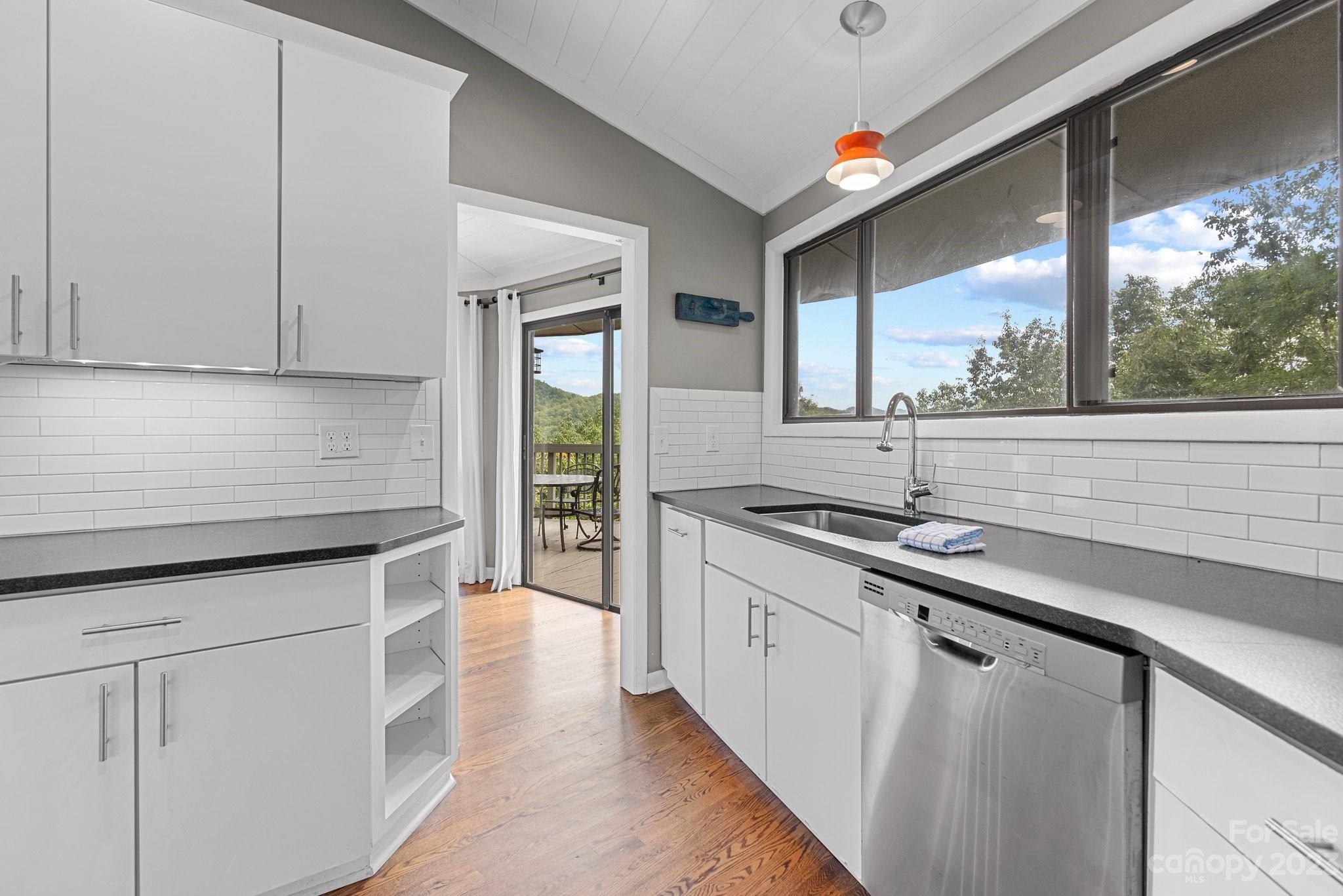 98 Westminster Road Montreat, NC 28711 - Photo 9 of 37 a kitchen with stainless steel appliances granite countertop a sink and a stove