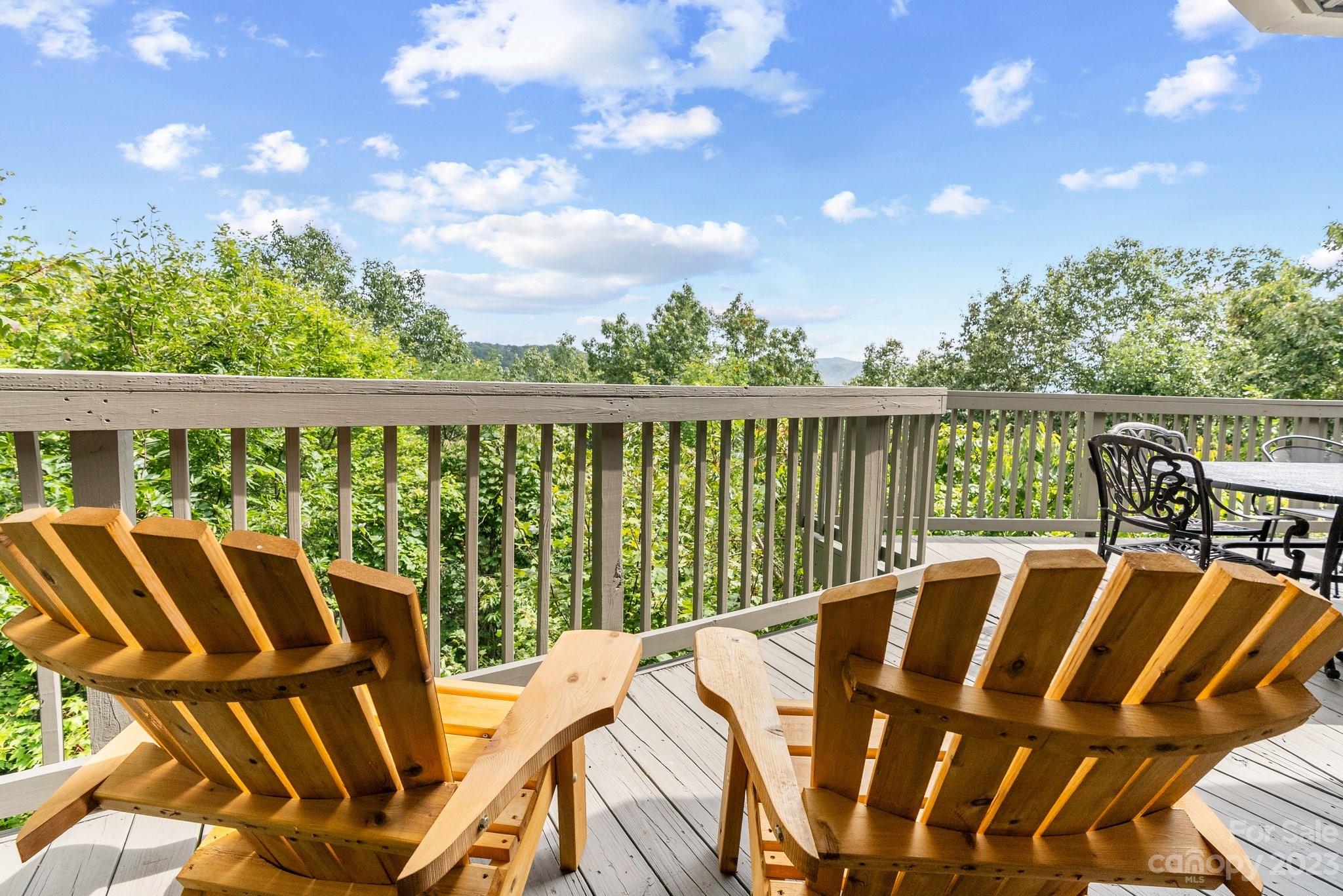 98 Westminster Road Montreat, NC 28711 - Photo 10 of 37 a view of a balcony with lake view and wooden floor