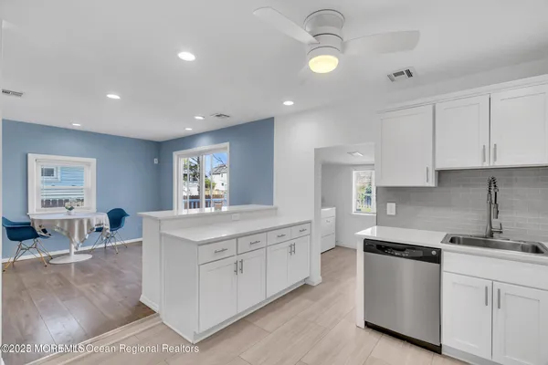 a kitchen with stainless steel appliances granite countertop a stove and a sink