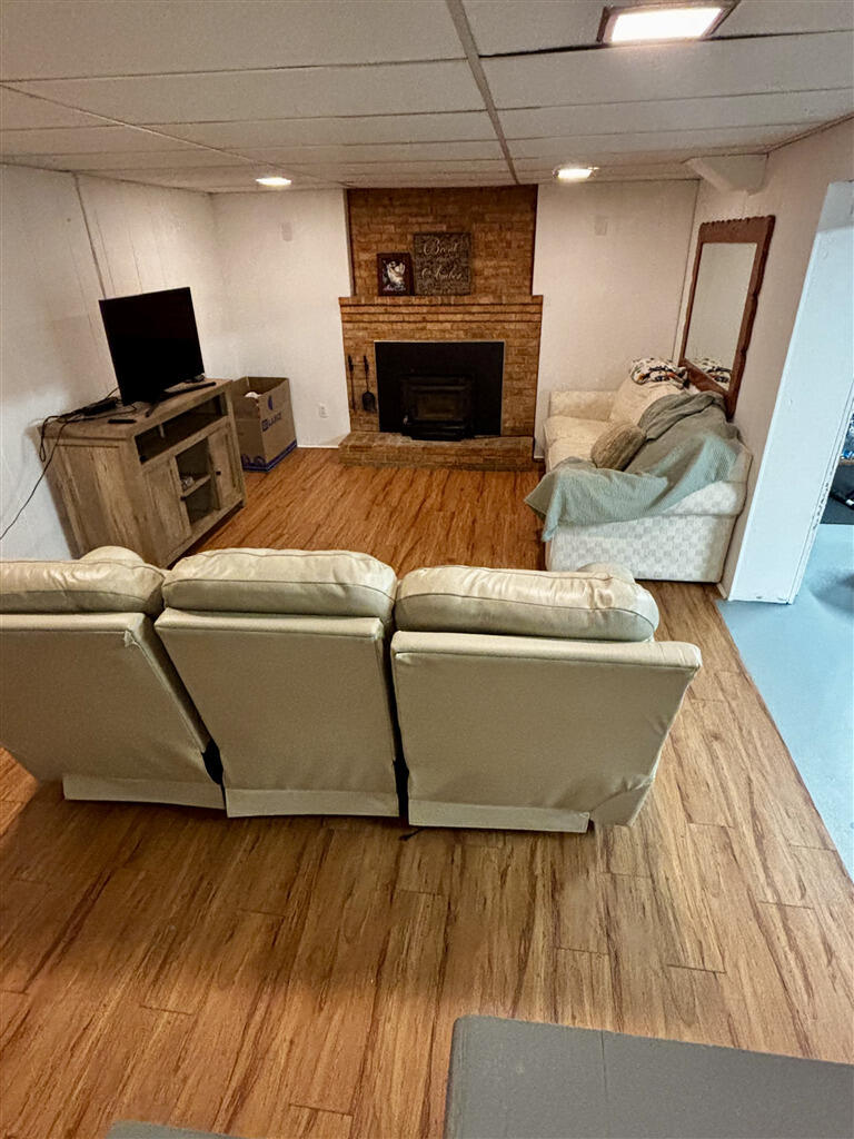 1032 Windy Ridge Drive Bedford, VA 24523 - Photo 27 of 27 a living room with furniture and a flat screen tv