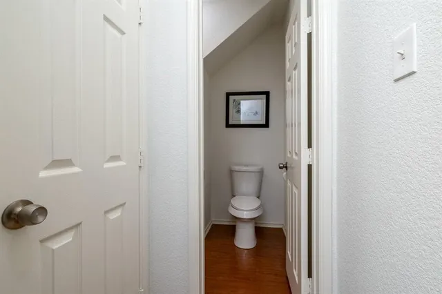 a bathroom with a toilet and a sink