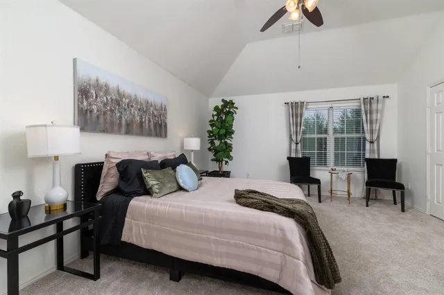 a bedroom with bed and a window