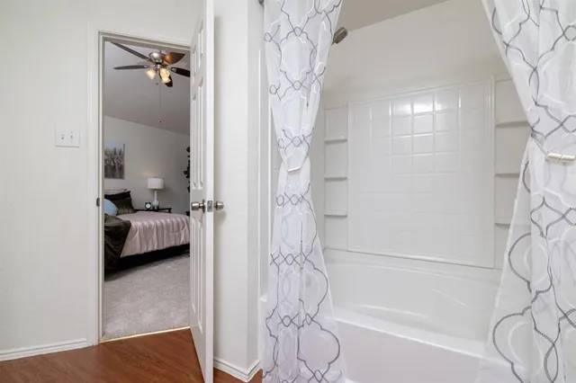 a en suite bathroom with a bathtub and shower