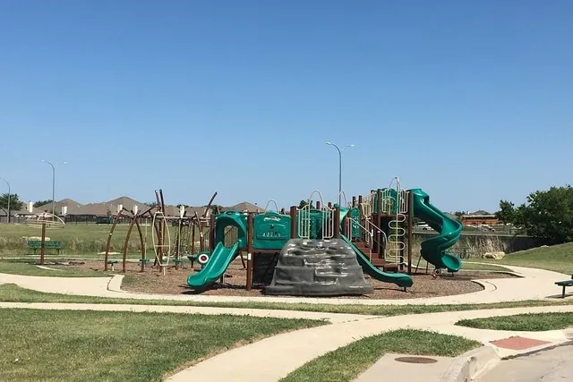 a view of a park with swings