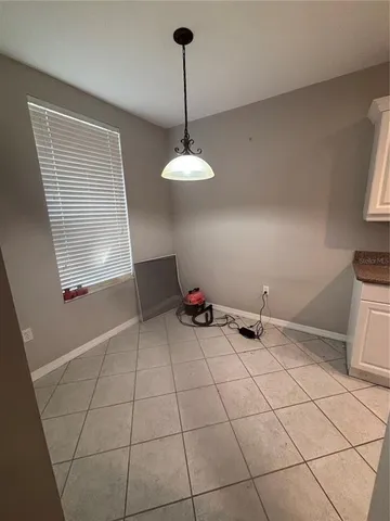 a kitchen with kitchen island granite countertop a stove a sink and a refrigerator