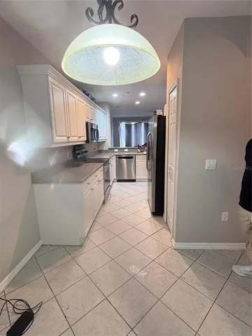 a view of a living room and kitchen