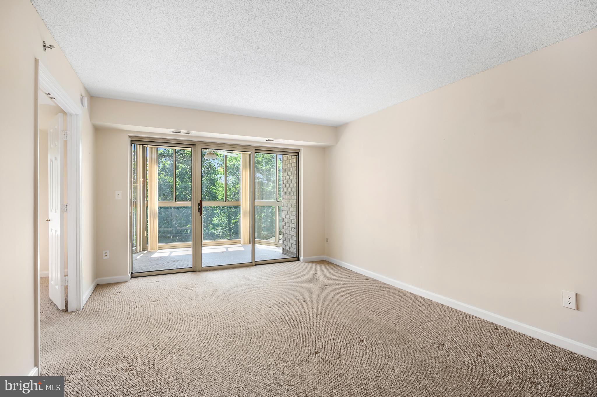 19385 Cypress Ridge Terrace, Unit 519 Leesburg, VA 20176 - Photo 3 of 43 Living Area with view of sunroom