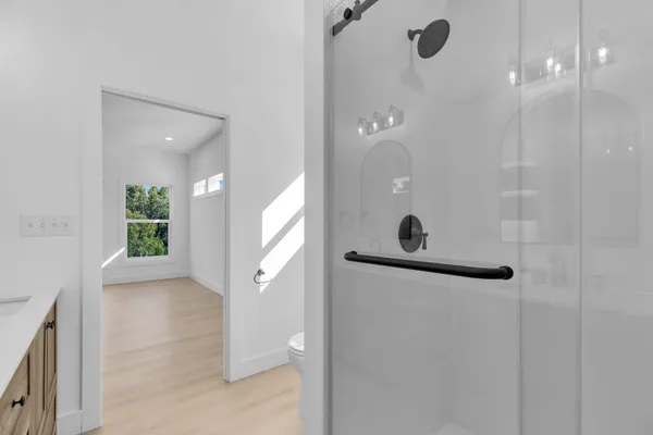 a kitchen with stainless steel appliances a kitchen island sink and wooden floor
