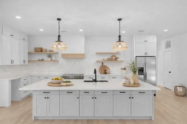 a view of a pathway with a palm tree