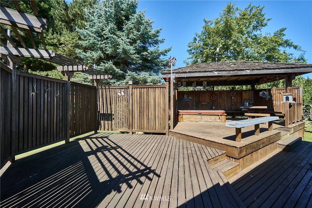 5304 West Highland Road Everett, WA 98203 - Photo 22 of 26 a view of backyard with a deck and wooden floor