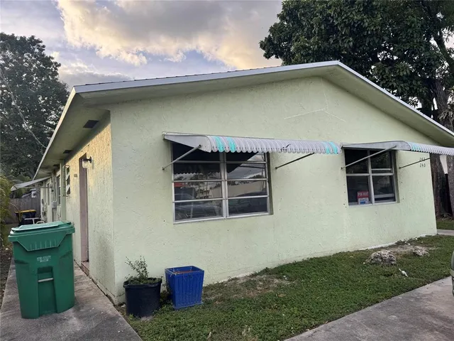 a front view of a house with yard