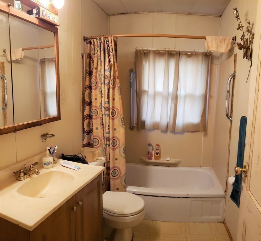 96 Lehigh Street Springfield, MA 01104 - Photo 11 of 11 a bathroom with a sink toilet and shower