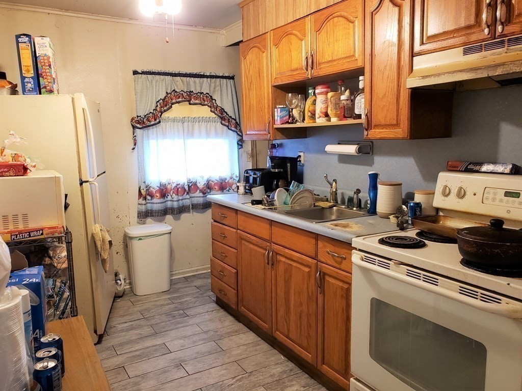 96 Lehigh Street Springfield, MA 01104 - Photo 6 of 11 a kitchen with a sink cabinets and appliances
