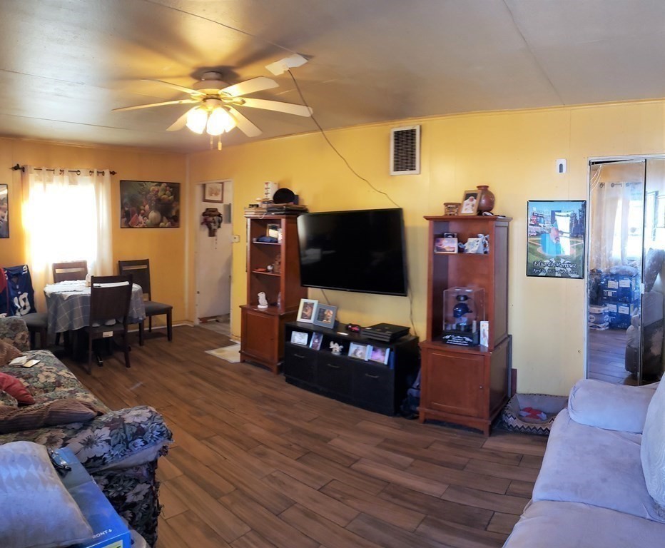 96 Lehigh Street Springfield, MA 01104 - Photo 7 of 11 a living room with furniture and a flat screen tv