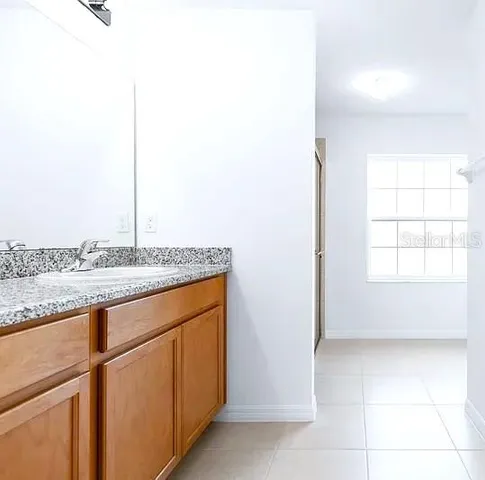 a view of a kitchen with granite countertop cabinets and sink