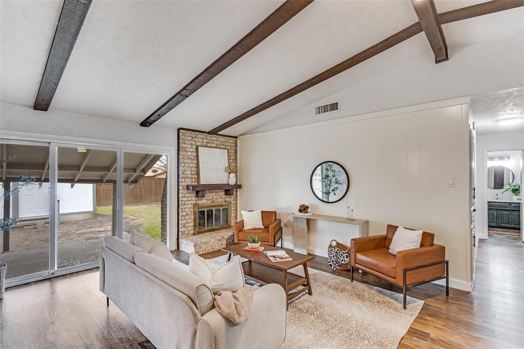 626 Shadyglen Drive Allen, TX 75002 - Photo 4 of 20 a living room with couch and a table with wooden floor