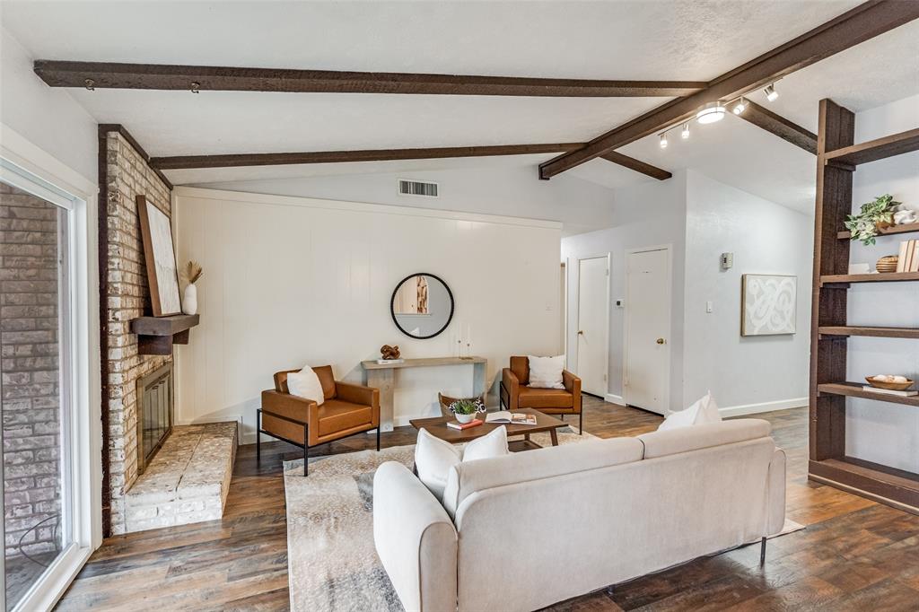 626 Shadyglen Drive Allen, TX 75002 - Photo 5 of 20 a living room with furniture and a clock