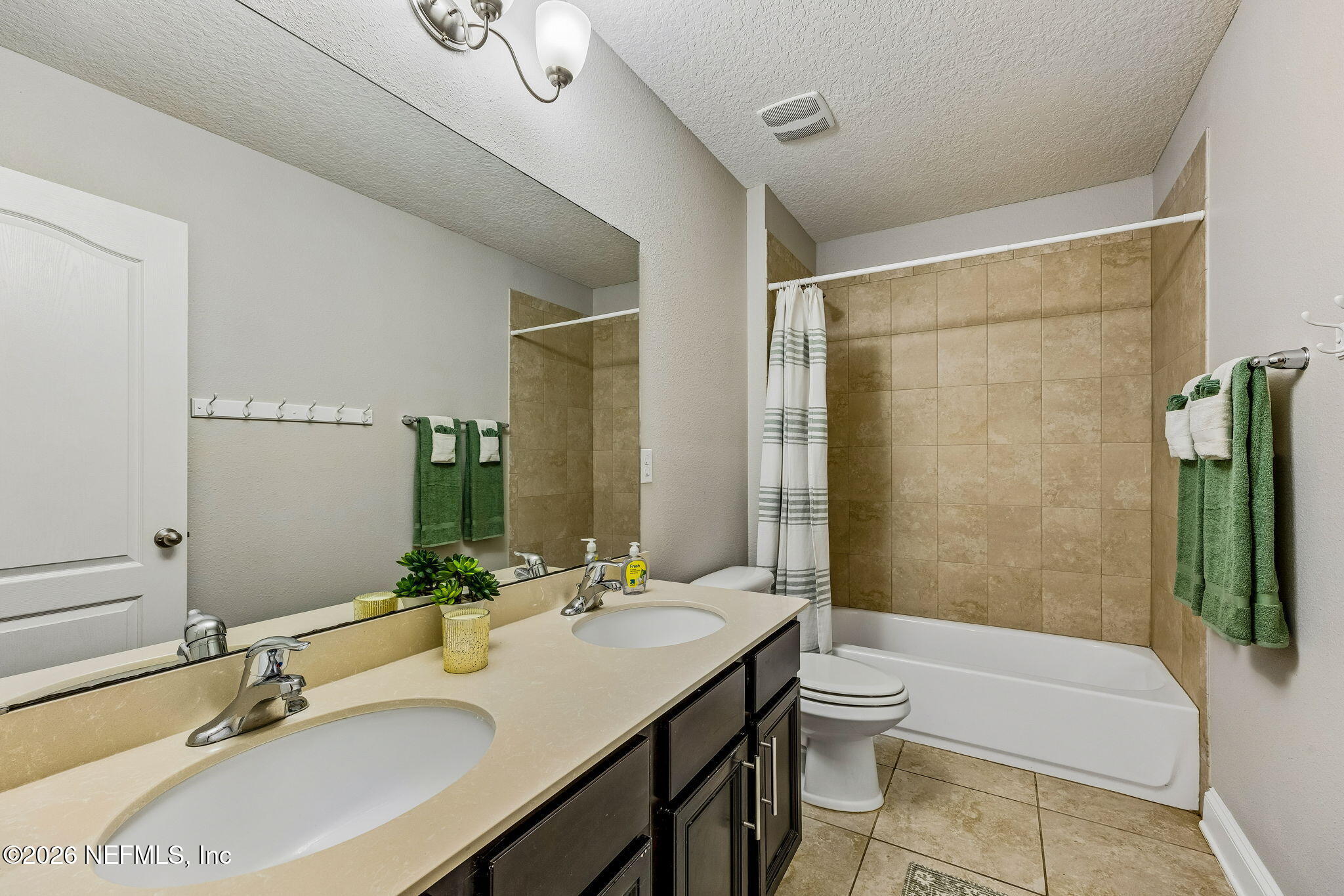 12198 Ridge Crossing Way Jacksonville, FL 32226 - Photo 38 of 67 a bathroom with a granite countertop sink toilet and shower