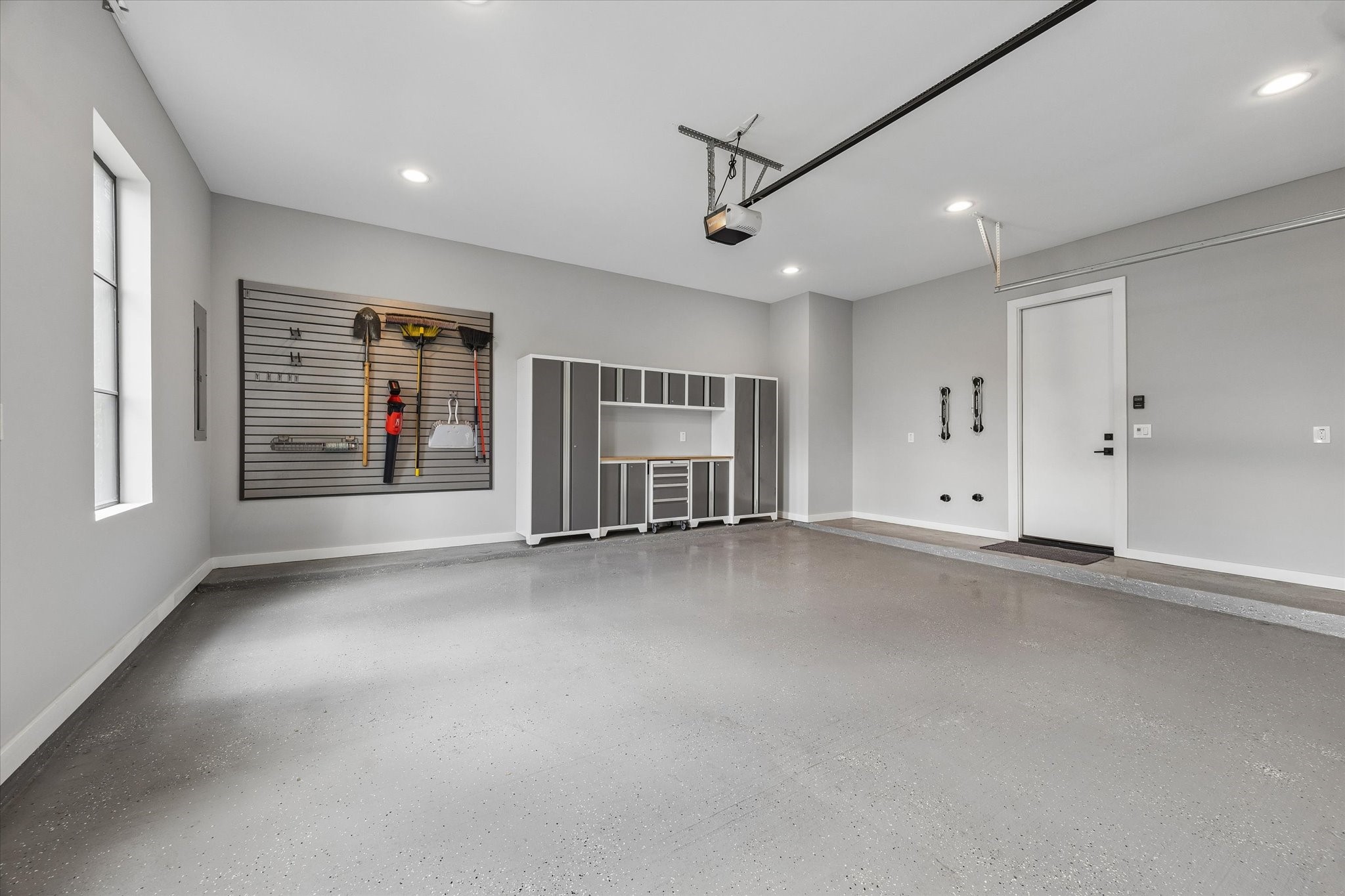 2705 Julian Street Houston, TX 77009 - Photo 41 of 50 Epoxy floor garage with builtins for storage. Designer paint!