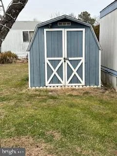 a blue house with pool in front of it