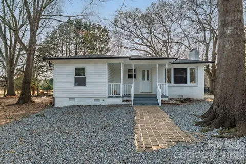 a house with trees in the background