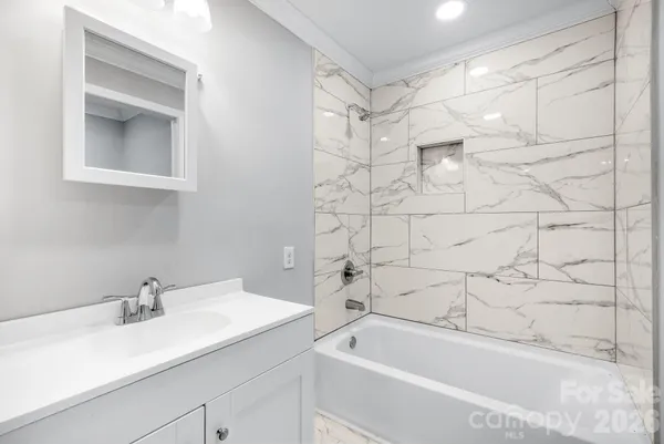 a bathroom with a sink and a bathtub