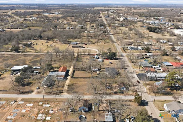 an aerial view of residential building with parking space