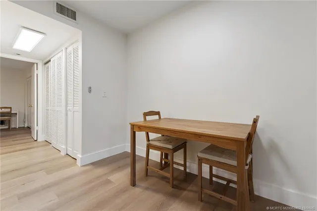 a kitchen with stainless steel appliances granite countertop a stove refrigerator sink and cabinets