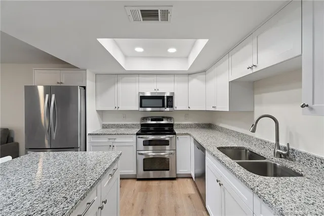 a view of a hallway with washer and dryer