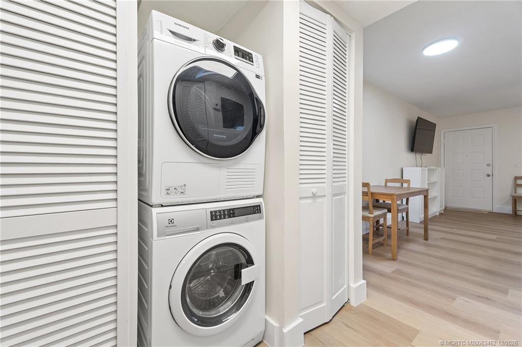 511 Southwest South River Drive, Unit 104 Stuart, FL 34997 - Photo 23 of 61 a view of a hallway with washer and dryer