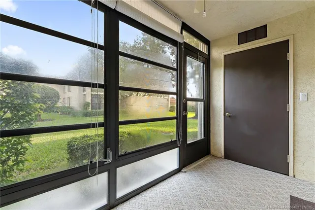 a view of a backyard with sitting area