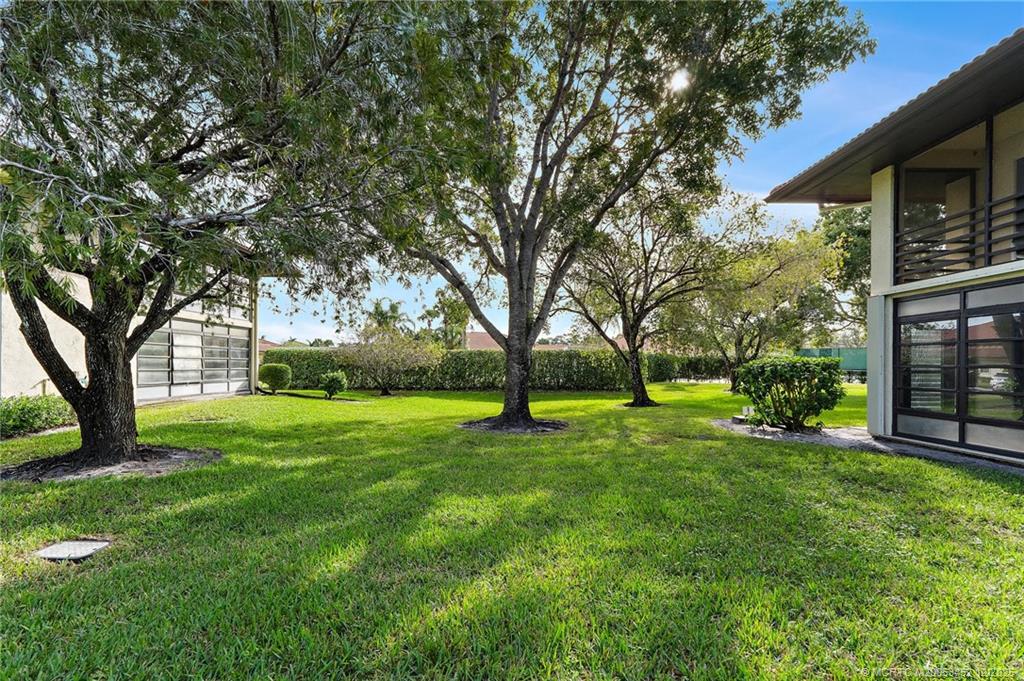 511 Southwest South River Drive, Unit 104 Stuart, FL 34997 - Photo 35 of 61 a view of a trees in front of a house
