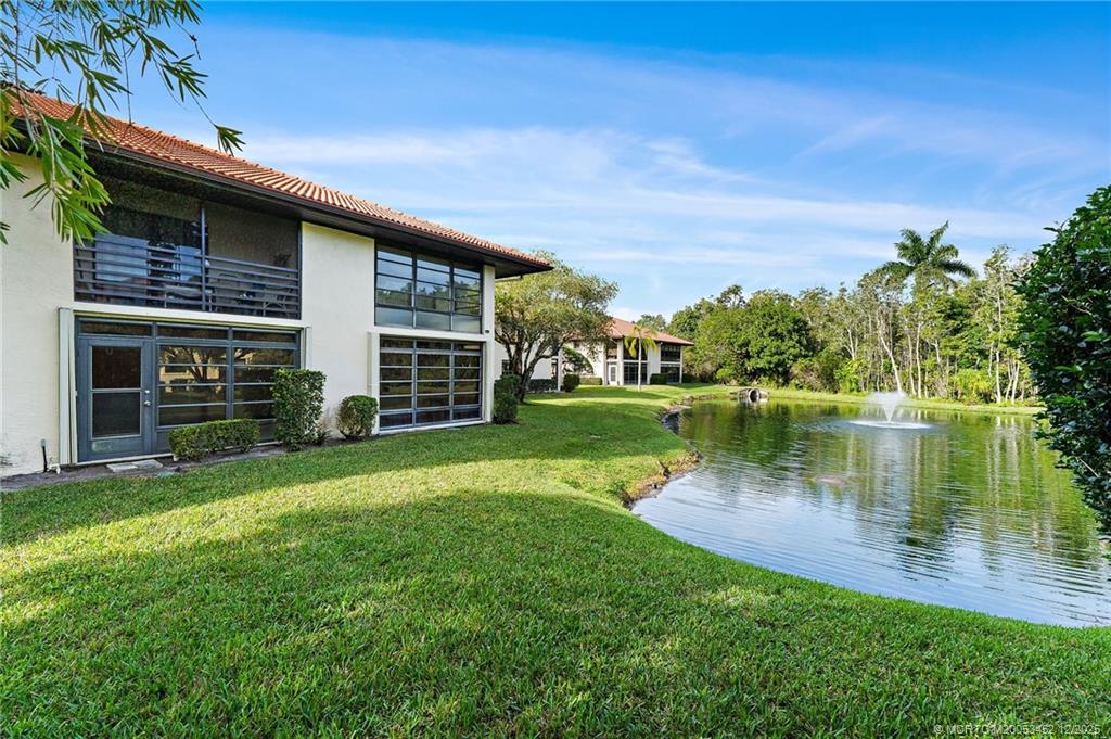 511 Southwest South River Drive, Unit 104 Stuart, FL 34997 - Photo 36 of 61 a view of a house with a yard