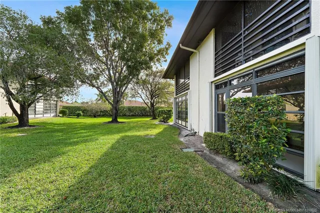 a view of a dining room with furniture and window