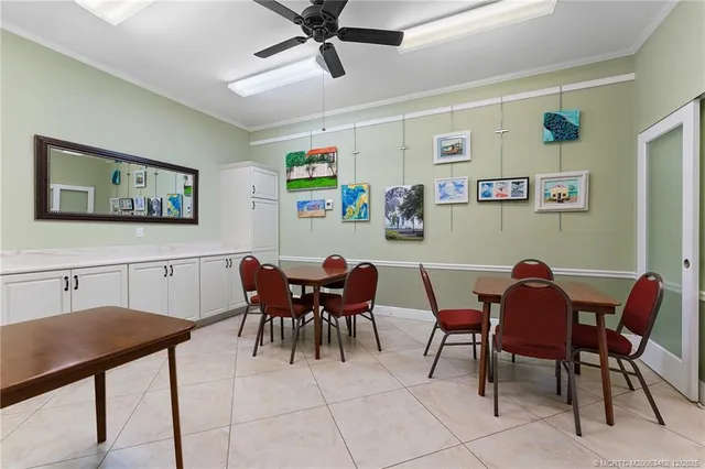 a living room with lots of furniture and clutter