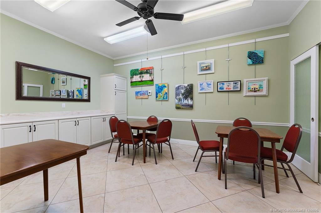 511 Southwest South River Drive, Unit 104 Stuart, FL 34997 - Photo 42 of 61 a view of a dining room with furniture