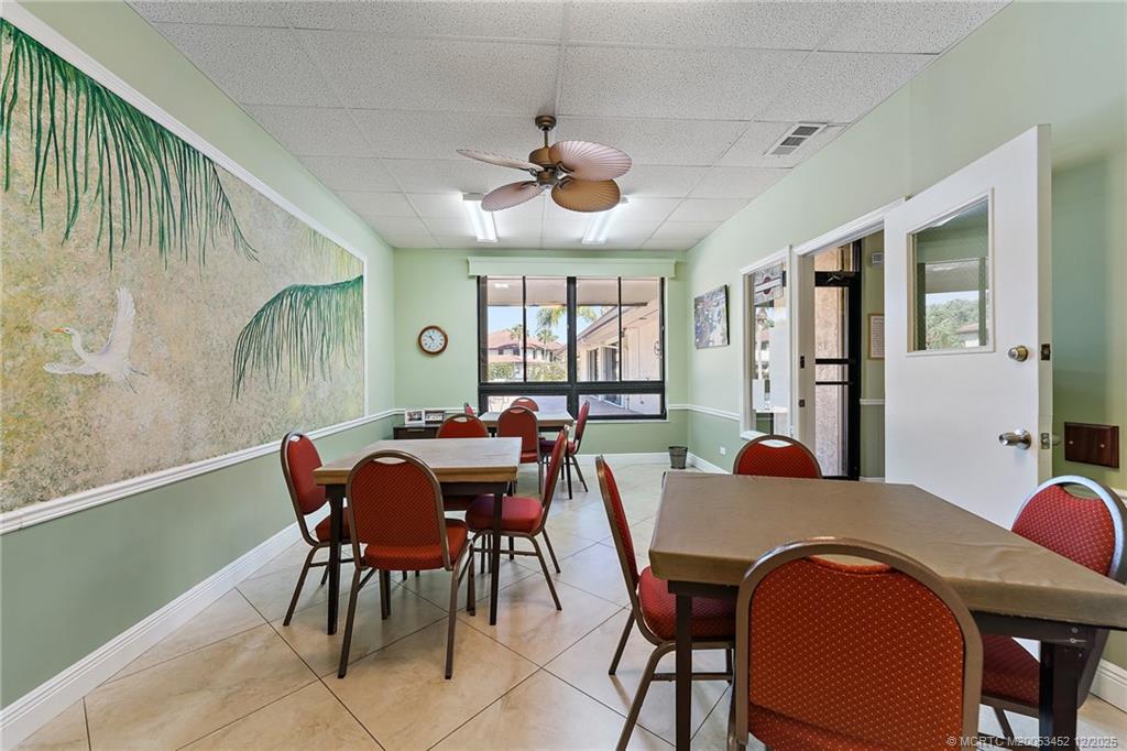 511 Southwest South River Drive, Unit 104 Stuart, FL 34997 - Photo 43 of 61 a view of a dining room with furniture and window