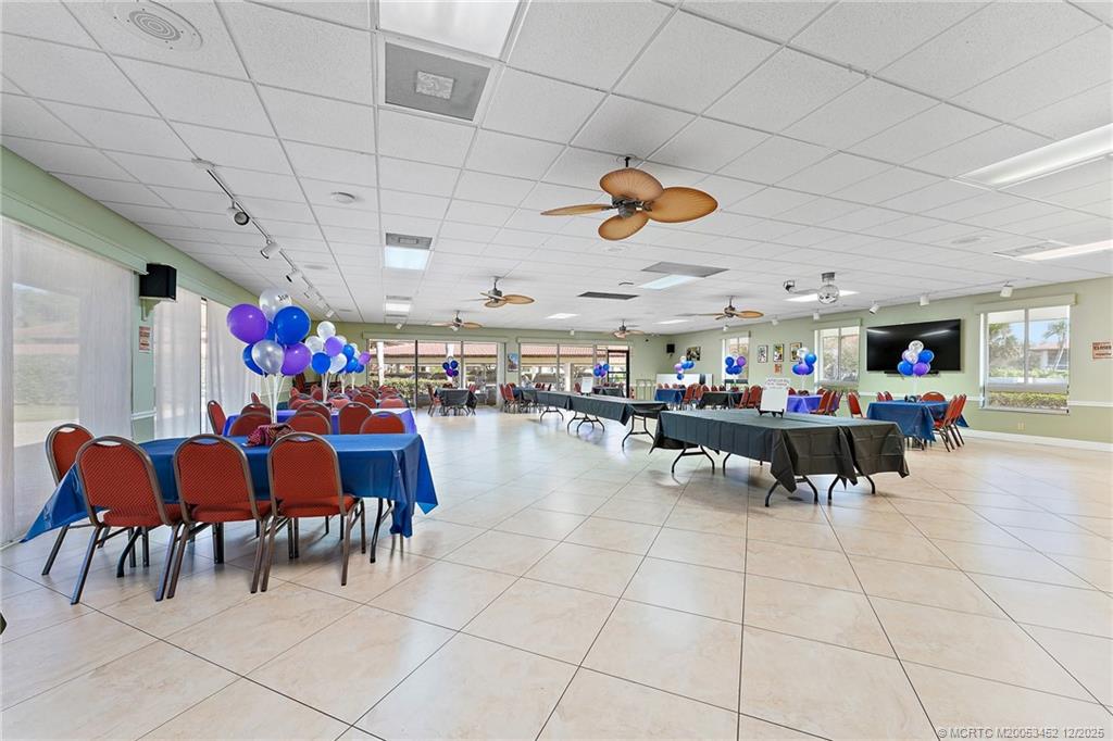 511 Southwest South River Drive, Unit 104 Stuart, FL 34997 - Photo 47 of 61 a living room filled with furniture and kitchen view