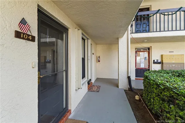 a room with a window and wooden floor