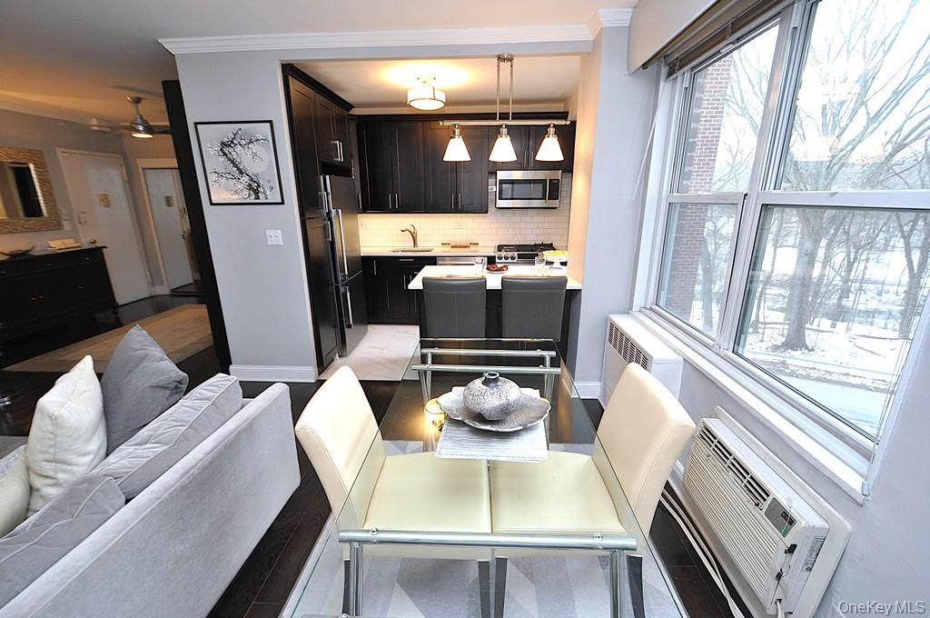 281 Garth Road, Unit A5L Scarsdale, NY 10583 - Photo 21 of 46 a living room with furniture and a window